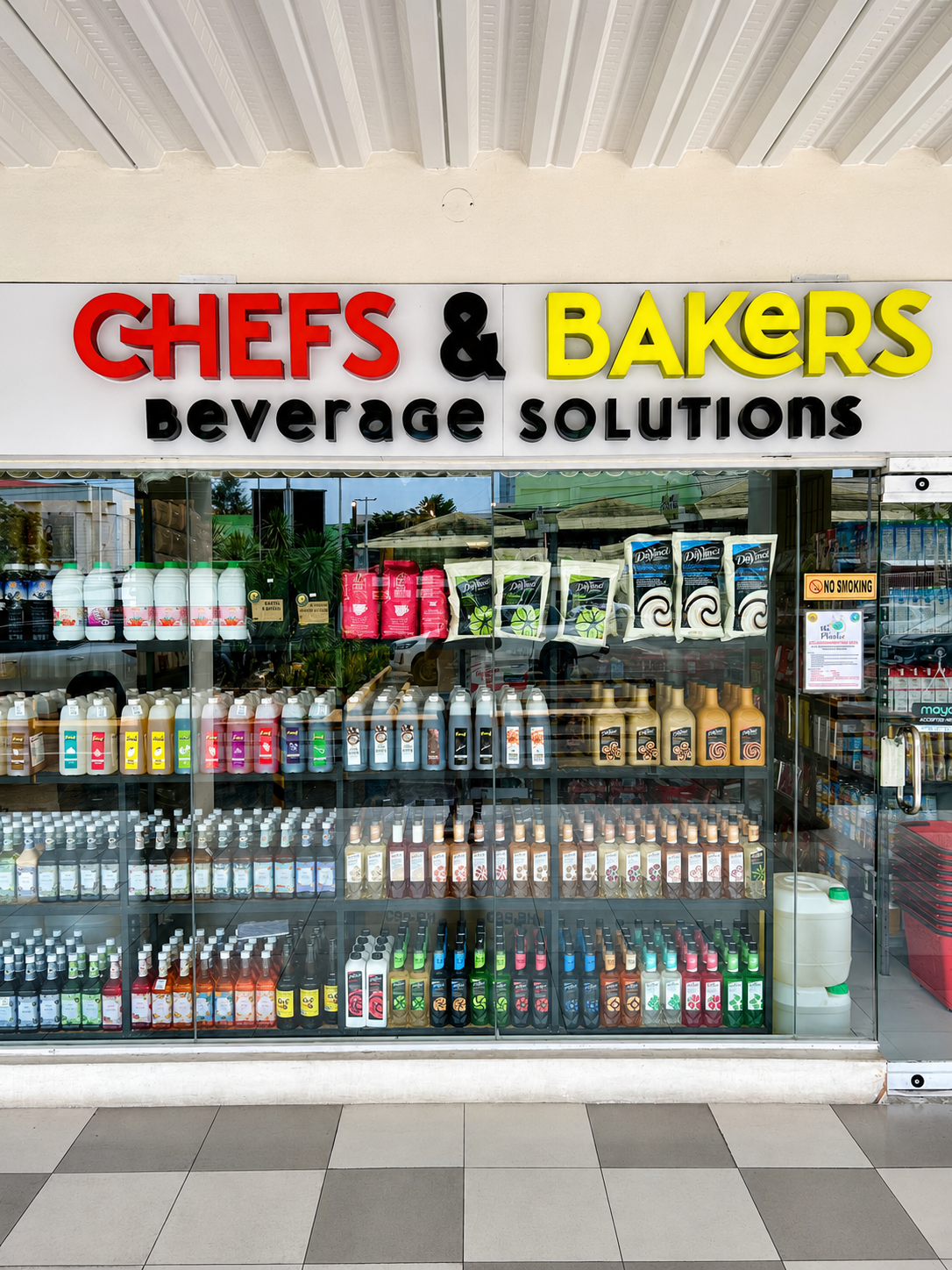 The C and B Beverage Solutions storefront in Cebu, with a window full of syrups and cafe supplies